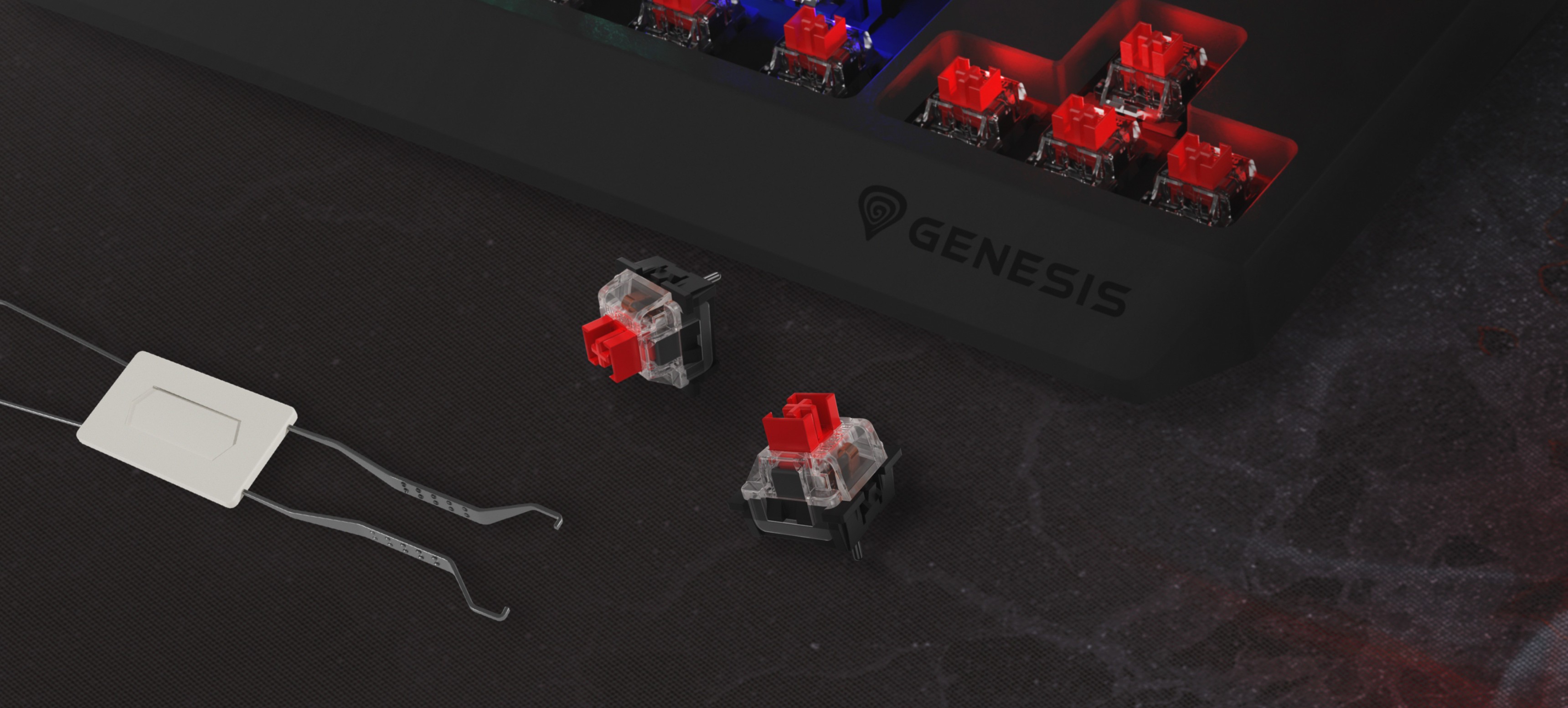 Zbliżenie klawiatury do gier Genesis Thor 230 TKL Lite z czerwonymi przełącznikami mechanicznymi Outemu i narzędziem do ściągania przełączników