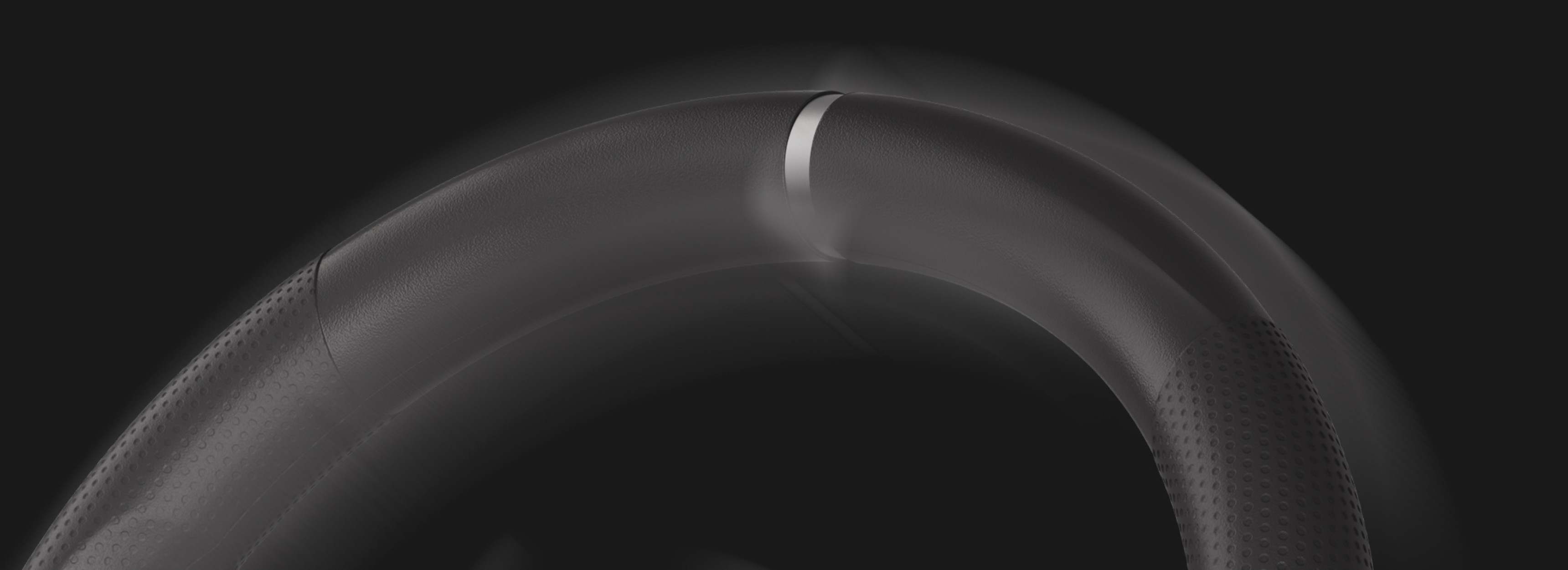 Zbliżenie na kierownicę wyścigową Genesis Seaborg 400 o eleganckim wyglądzie i teksturowanym uchwycie dla lepszej kontroli