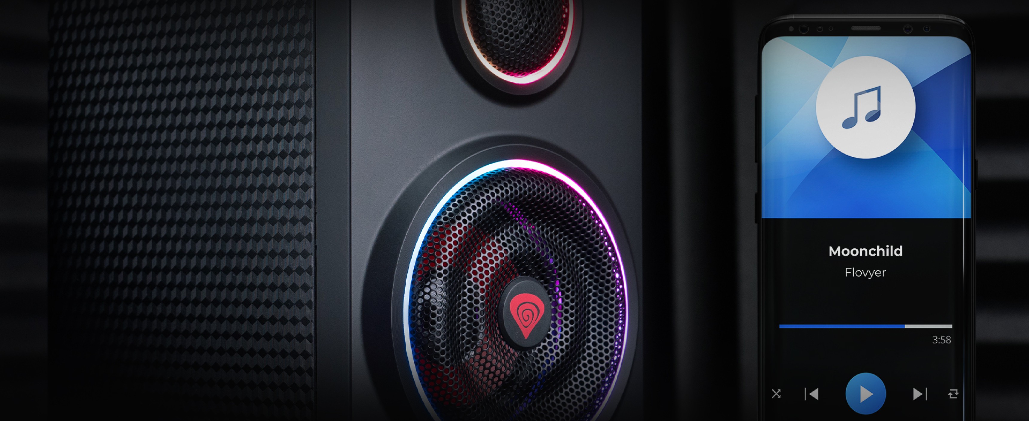 Głośniki Bluetooth Genesis Helium 300BT z oświetleniem ARGB, prezentujące żywy design głośnika i podłączony wyświetlacz smartfona