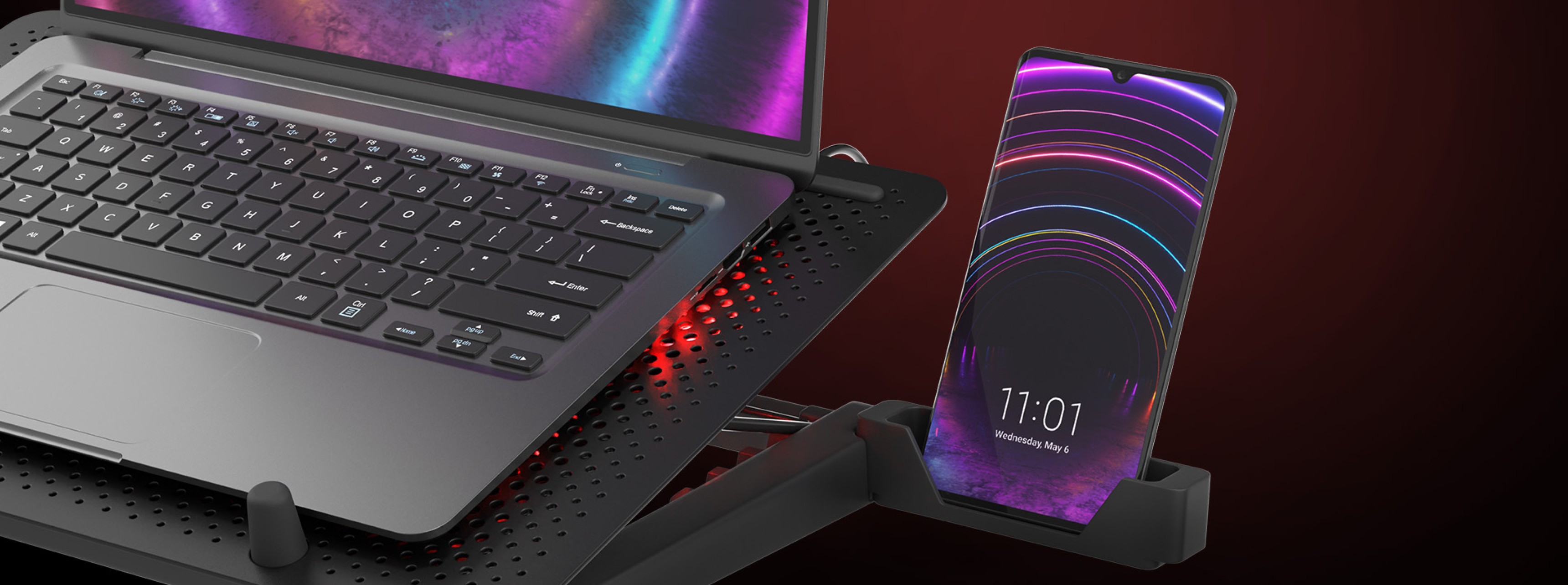 Podkładka chłodząca pod laptopa z pięcioma wentylatorami, przeznaczona do laptopów 15,6-17,3". Wyposażona w oświetlenie RGB i port USB oraz uchwyt na telefon