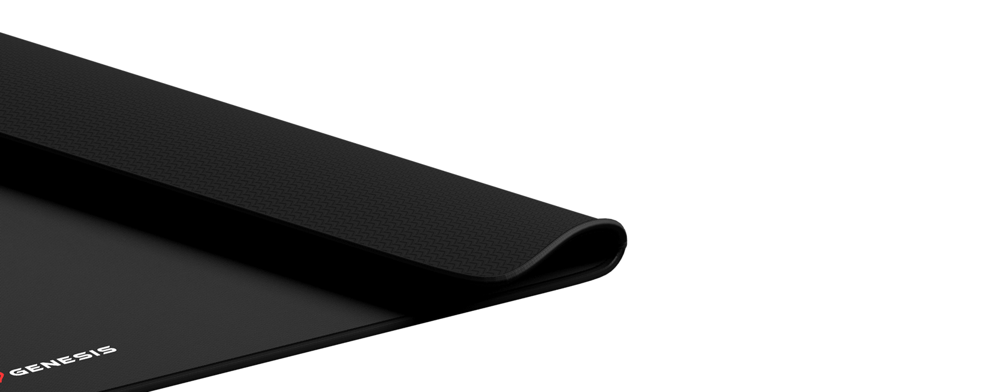 Czarna podkładka pod mysz Genesis Carbon z teksturowaną powierzchnią o wymiarach 500 x 400 mm, z subtelnym logo w rogu.