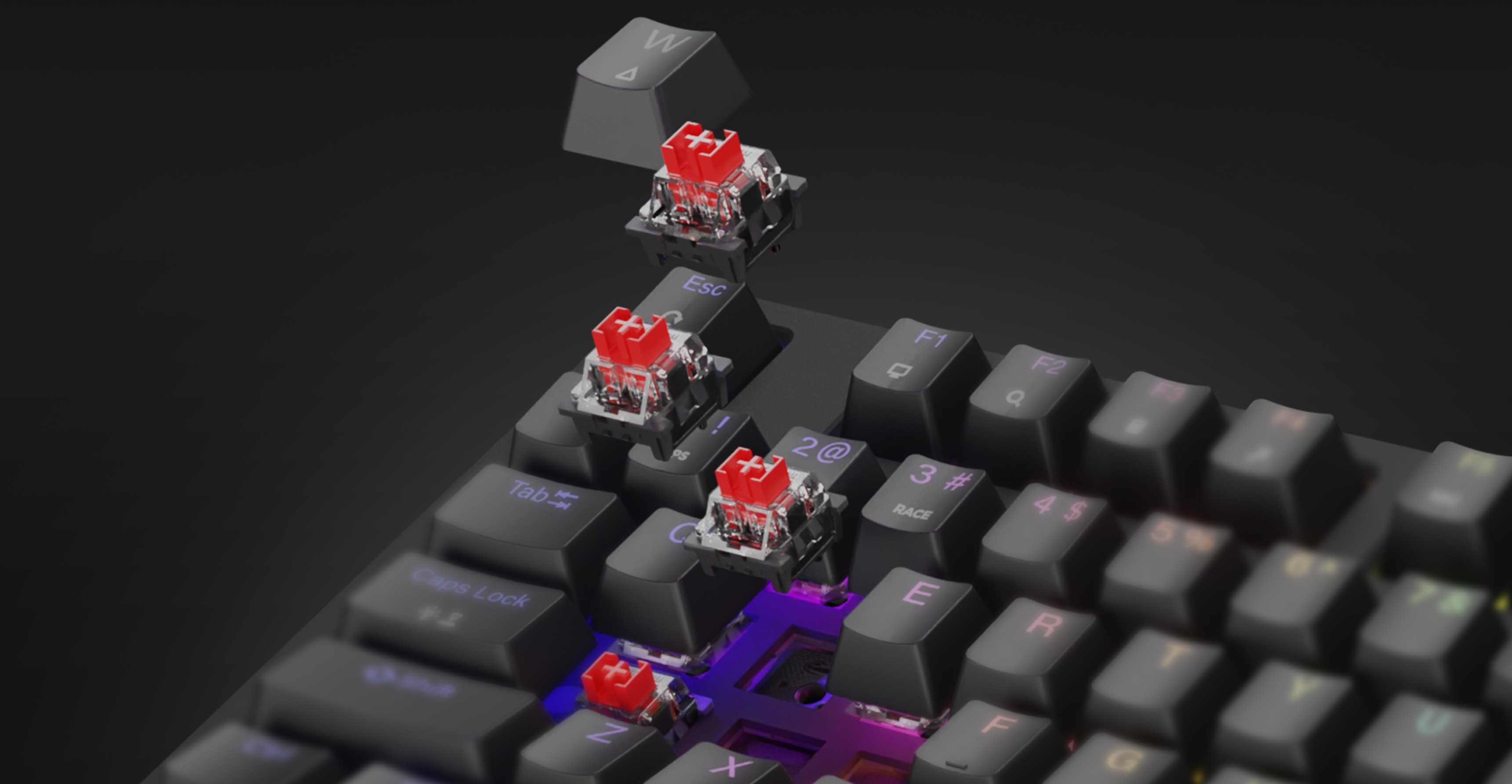 Mechaniczna klawiatura do gier z czerwonymi przełącznikami i tęczowym podświetleniem RGB, z możliwością wymiany klawiszy i przełączników podczas pracy.