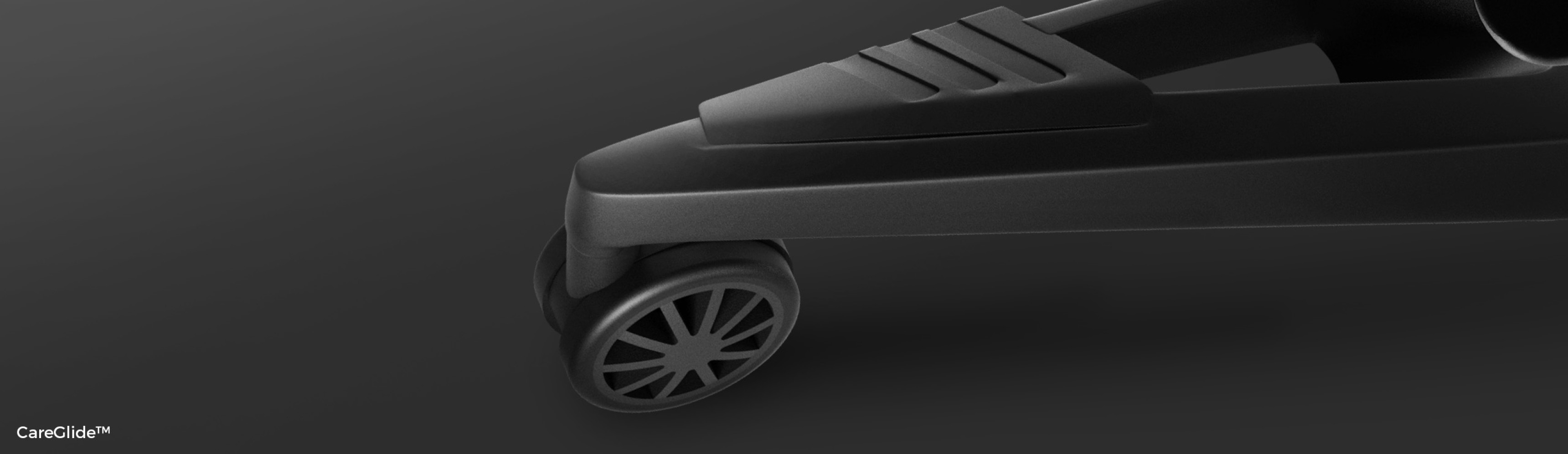 Zbliżenie na kierownicę i podstawę czarnego fotela ergonomicznego Genesis Astat 700 G2, ukazujące jego elegancki, nowoczesny design.